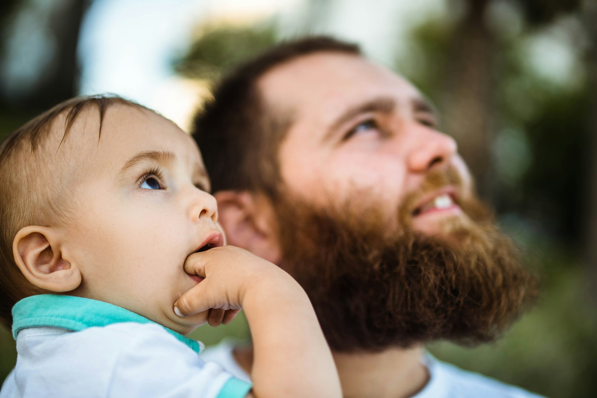 Daddy and child looking up. Candid portraits