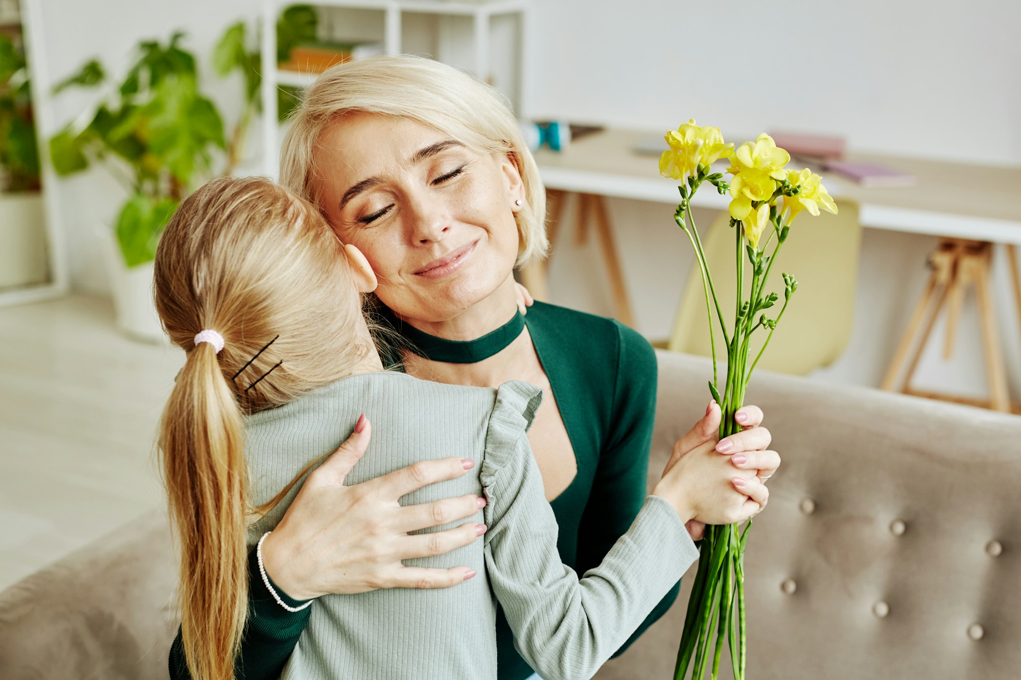 Girl Embracing Mom on Mothers Day