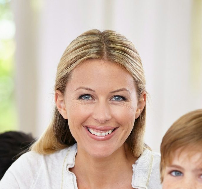 Shes a dedicated educator. Portrait of a smiling teacher with her student and copyspace.